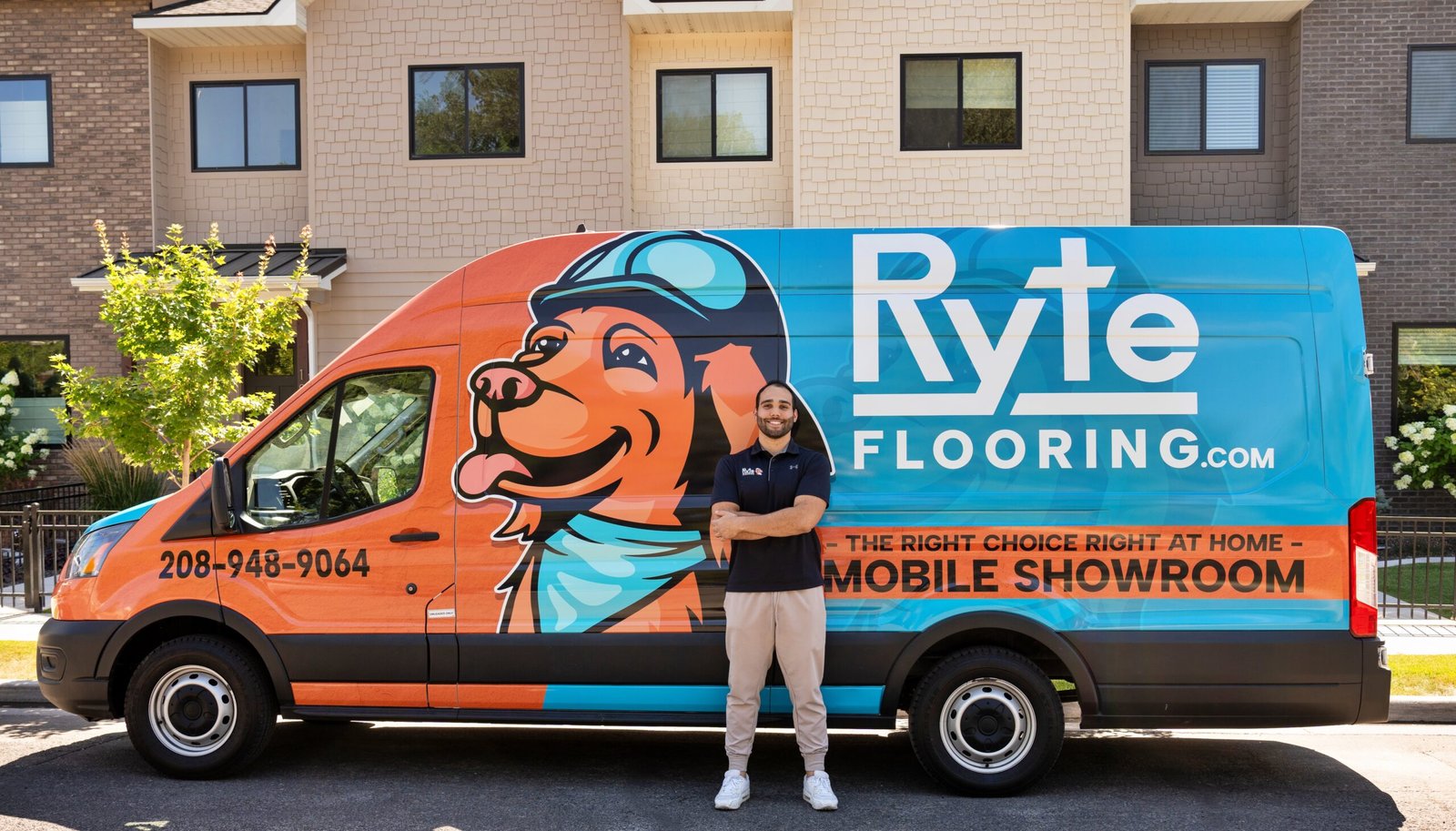 Professional Flooring Installer in Front of Mobile Showroom Professional flooring installer standing in front of mobile flooring showroom.
