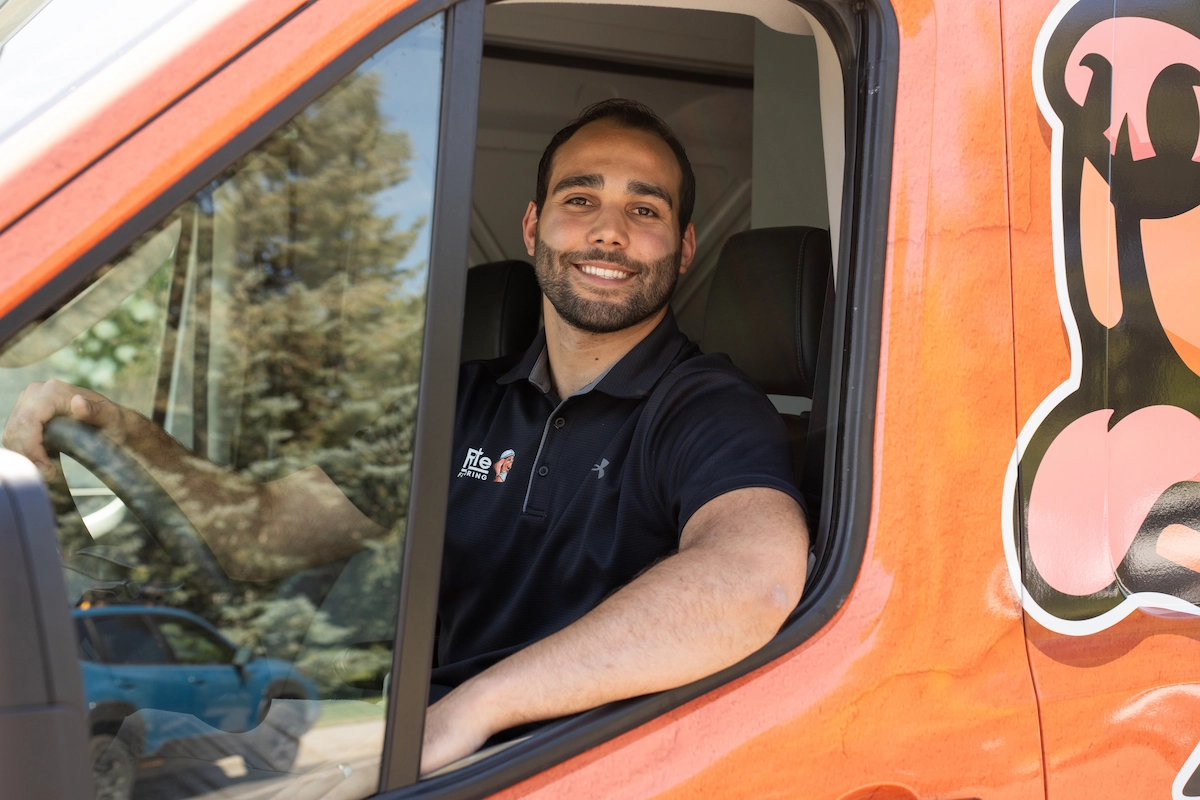 ryte-flooring-owner-lucas-mobile-showroom Ryte Flooring owner Lucas smiling in the driver's seat of the mobile showroom van, heading to a flooring consultation in Twin Falls.