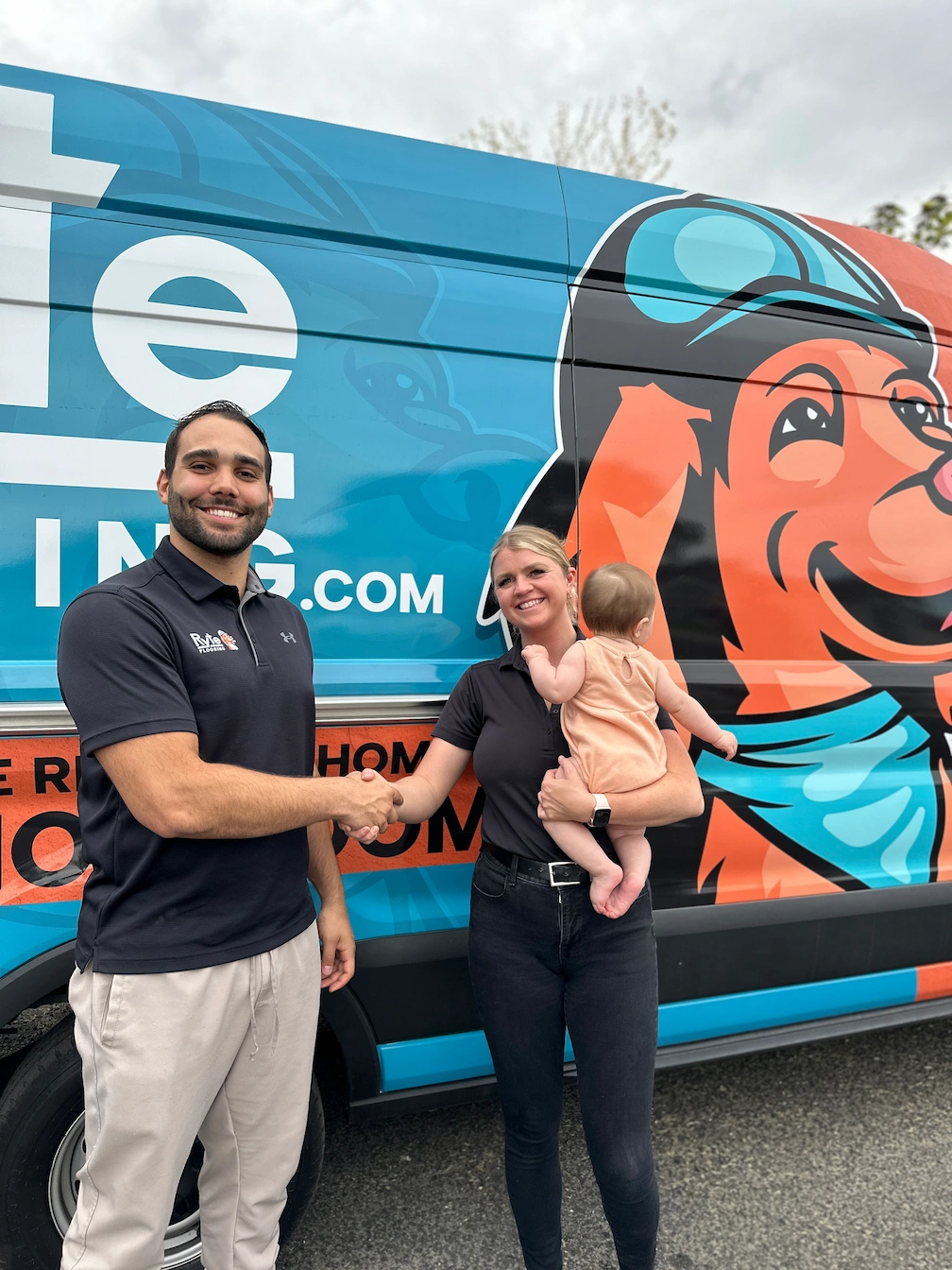 Ryte Flooring owner shaking hands with a happy customer in Twin Falls, representing family-friendly service and successful project completion.