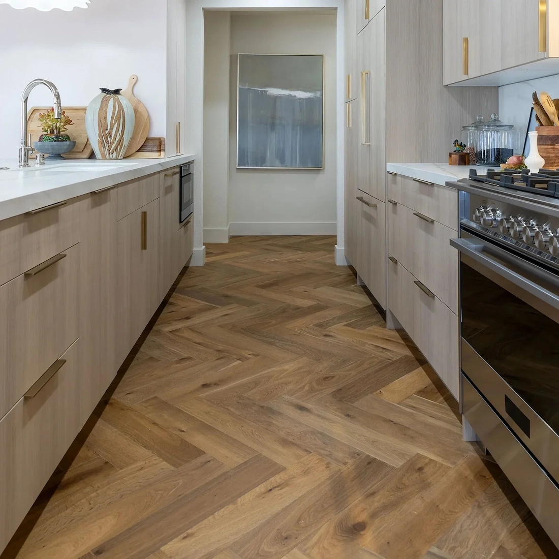 Custom herringbone pattern engineered hardwood flooring installed in a modern kitchen in Twin Falls.